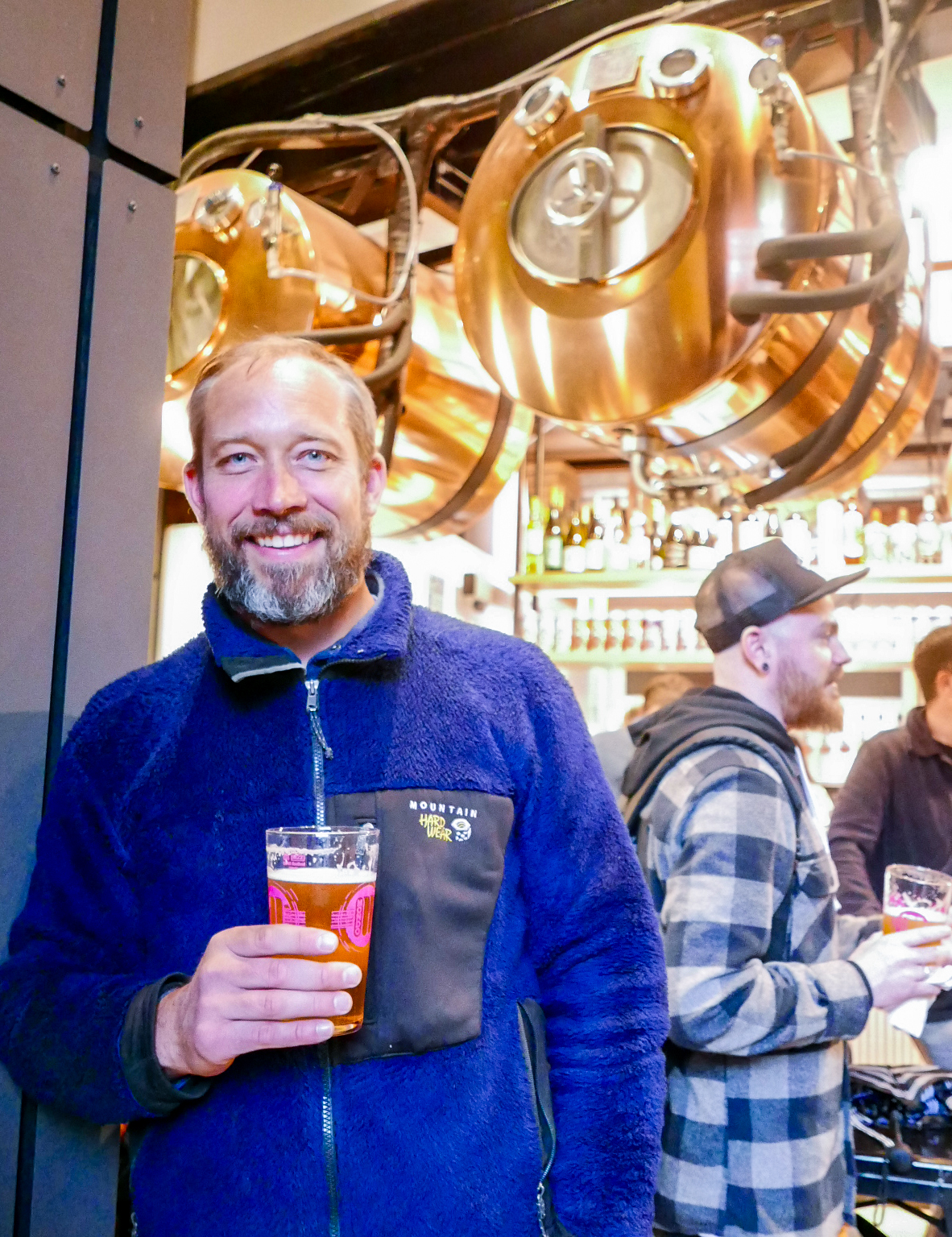 Co-Owner, Todd stands beneath the serving tanks at Mondo's new Beer + Pizza venue.